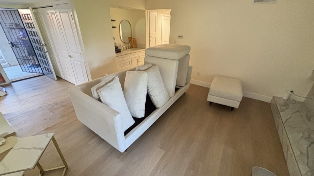 Cream sofa and ottoman after cleaning